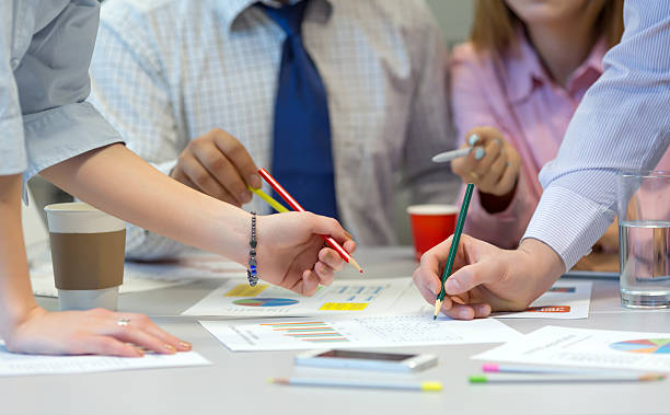 istock Business Team networking - office Table with Charts People Hands 528897990