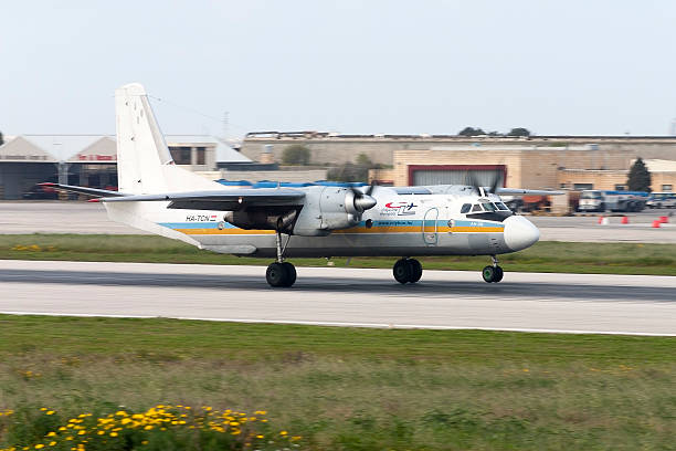 Cargo Antonov An-26 landing runway 14. Luqa, Malta - March 16, 2005: Cityline Hungary Antonov An-26 antonov an 26 stock pictures, royalty-free photos & images