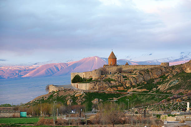 istock Ancient monastery in front of mountain 528898560