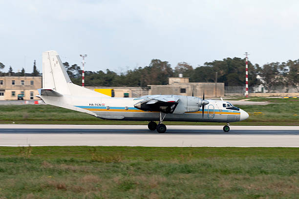 Cargo Antonov An-26 landing runway 14. Luqa, Malta - March 16, 2005: Cityline Hungary Antonov An-26 antonov an 26 stock pictures, royalty-free photos & images