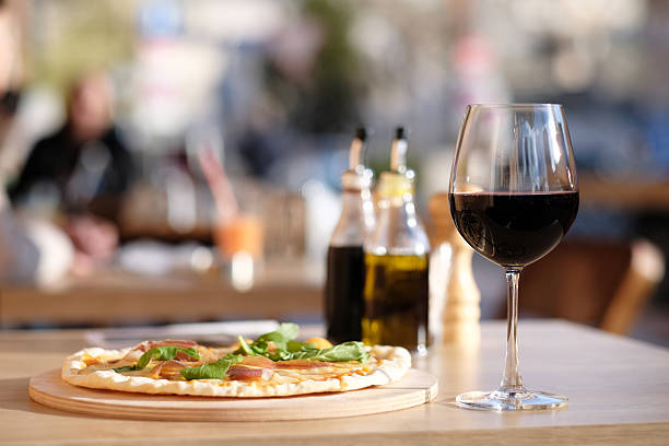 istock Pizza and red wine in restaurant 528898670