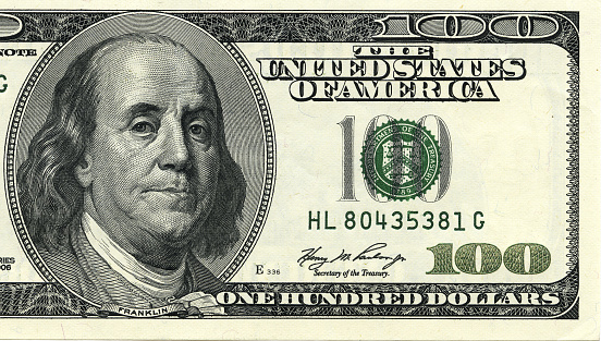 One hundred dollar bill macro shot. Benjamin Franklin as depicted on the bill.