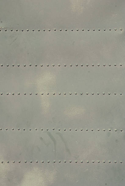 istock old rough steel plate with rivets, beige color 528901860