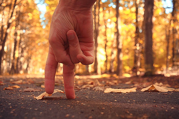 hand fingers are going autumn park