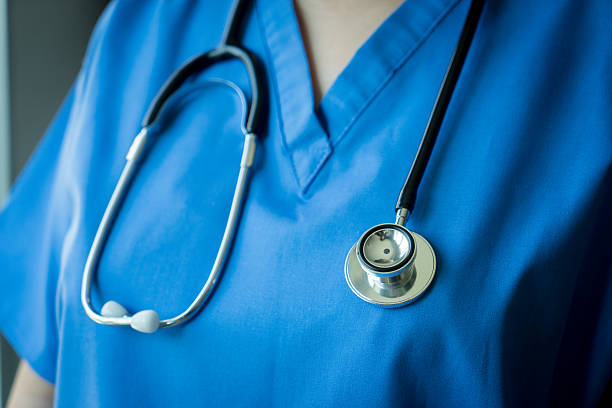 Stethoscope on nurse & doctor coat background