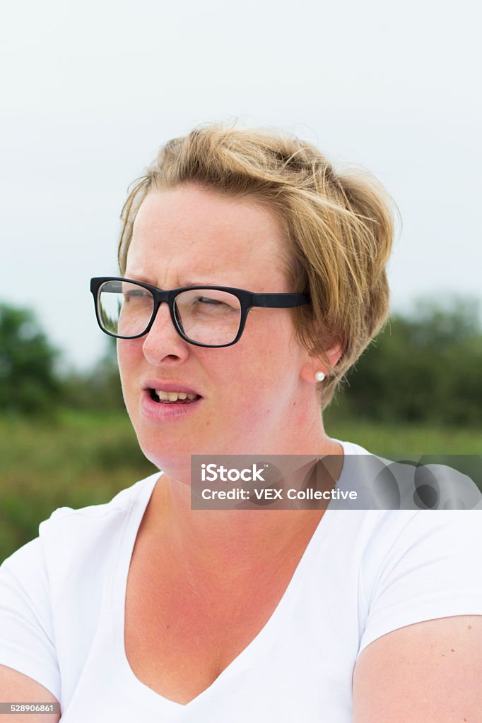 blonde woman drives a boat A blonde woman driving a  boat Adult Stock Photo