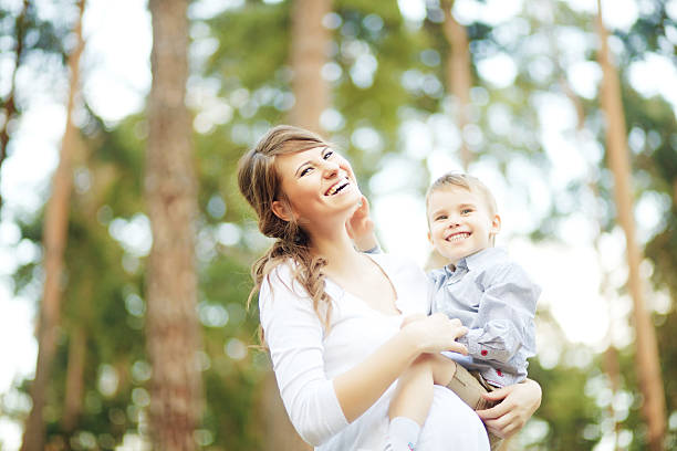 istock Pregnant woman with her son in a forest 528906949