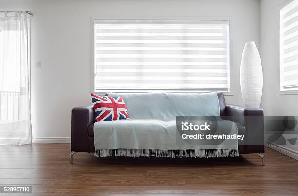 Modern Sofa In Bright Living Room With Zebra Blinds Stock Photo - Download Image Now