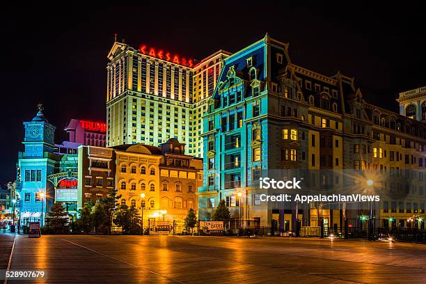 Buildings On The Boardwalk At Night In Atlantic City Stock Photo - Download Image Now