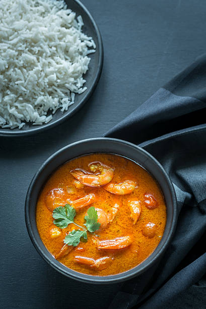 istock Thai yellow curry with seafood and white rice 528907690