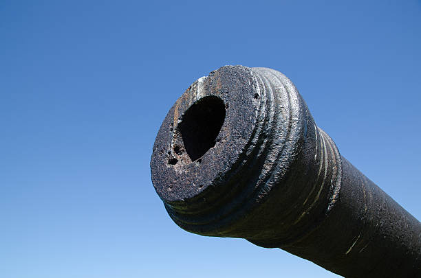 Old cannon muzzle at blue sky