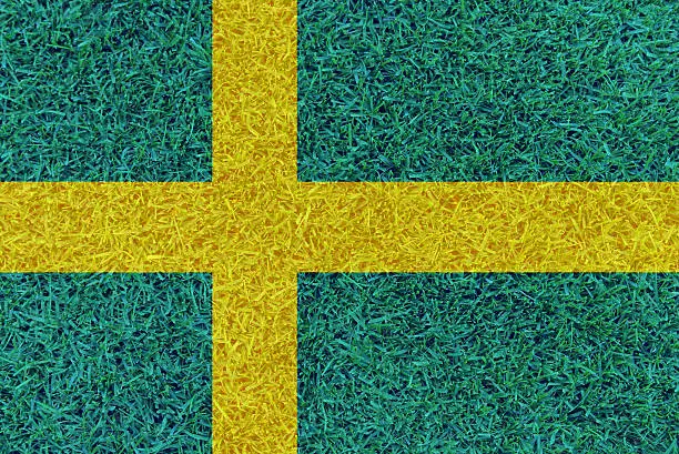 Football field textured by Sweden national flag