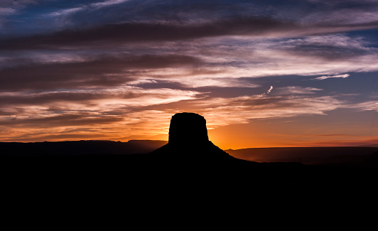 Turret Arch silhouette in last rays of sunset. Arches National Park, Utah.