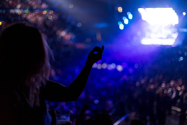 istock girl dancing at rock concert 528910803
