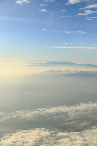 istock Blue sky with clouds and mountains background, aerial photography 528912033