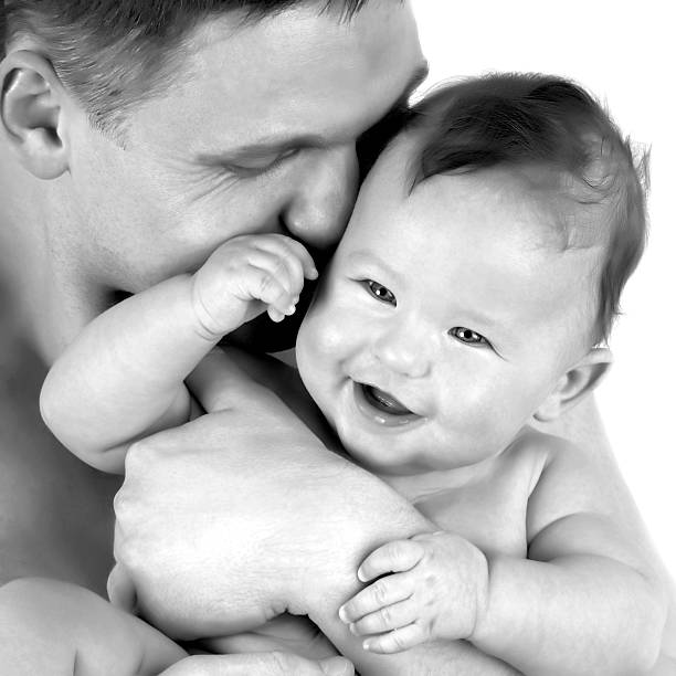 istock Baby on the fathers hands 528912189