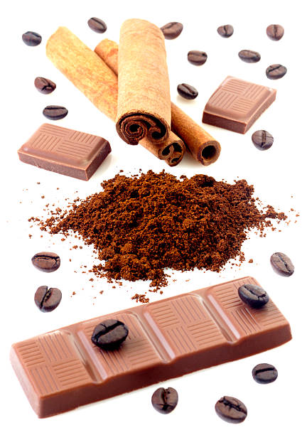 istock Cinnamon with chocolate and coffee beans isolated on white background 528912320