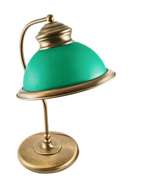 Metal table-lamp with a green lampshade isolated over white background