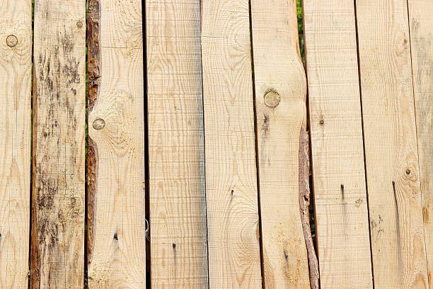 Flat view of a wooden split-pole fence.