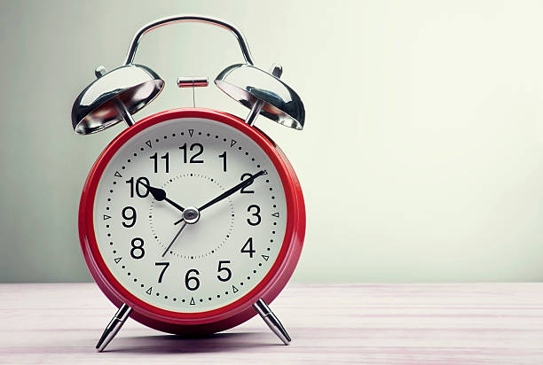 istock red alarm clock morning wake-up time 528914732