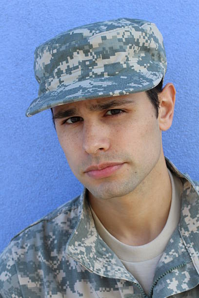istock Portrait of serious solider wearing hat 528916358