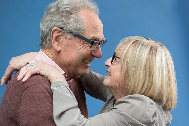 istock Senior couple looking lovingly and smiling 528916450