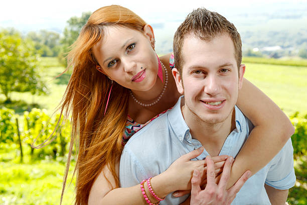Young love couple is hugging each other in nature