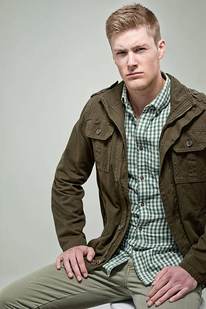 istock Casual man sitting and looking at camera 528919220