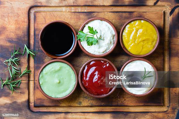 Sauces Ketchup Mustar Mayonnaise Wasabi Soy Sauce In Clay Bowls Stock Photo - Download Image Now