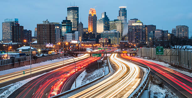 Minneapolis Winter Commute Heavy traffic flowing in and out of Minneapolis just after sunset, on a cold winter evening. minneapolis stock pictures, royalty-free photos & images