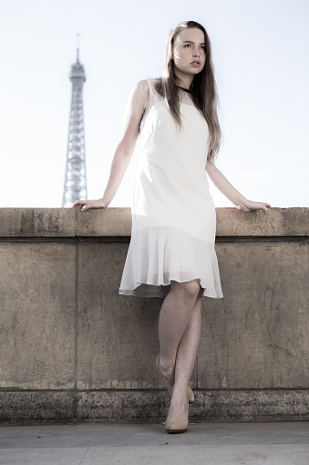 Parisian Girl Leaning Against A Wall At The Trocadero Centre