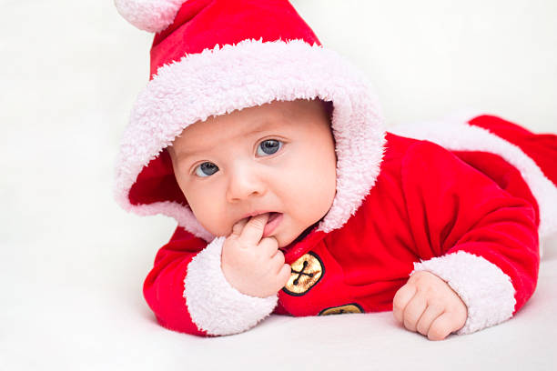 istock Baby wearing Christmas Santa suit. 528921912