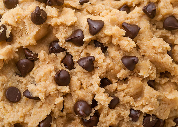 Chocolate Chip Cookie Dough Close up shot of chocolate chip cookie dough. dough stock pictures, royalty-free photos & images