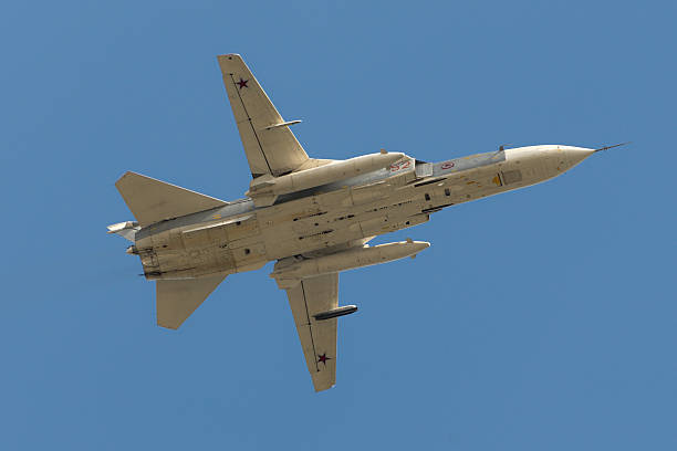 Soviet bomber Sukhoi Su-24 Fencer Moscow, Russia - May 07, 2016: Soviet bomber Sukhoi Su-24 Fencer flying over Red Square. Dress rehearsal of the Victory Day parade on Red Square. soviet supersonic military jet stock pictures, royalty-free photos & images