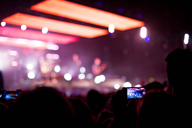 istock rock concert with smartphone 528927451