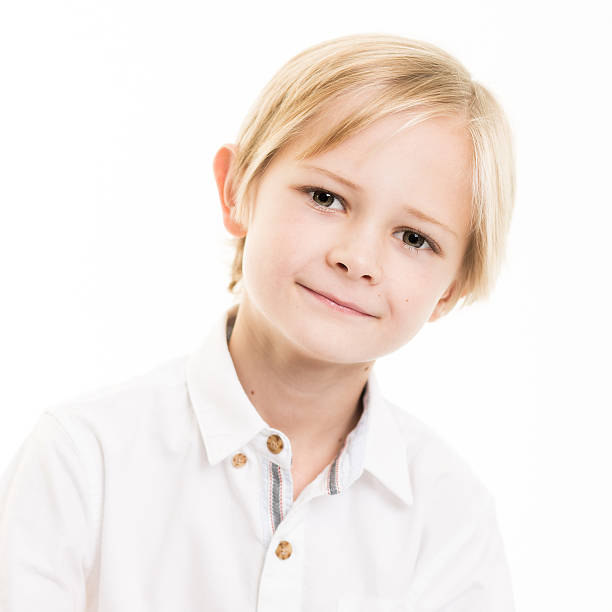 istock Blond Young Boy Isolated in White SHirt 528931099