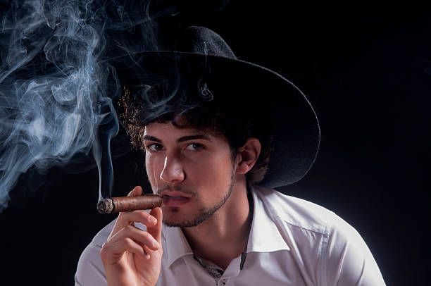 istock Young black man wearing hat gangster style 528931117