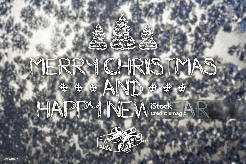 Merry Christmas and New Year greeting card Merry Christmas and New Year hand drawing greeting card on blurred frozen winter silver or gray colored background Celebration Stock Photo