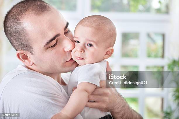 Gentle Young Father Comforting Crying Baby Stock Photo - Download Image Now - Adult, Affectionate, Baby - Human Age