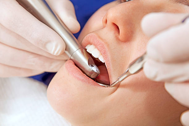 istock Young woman at dentist 528933065