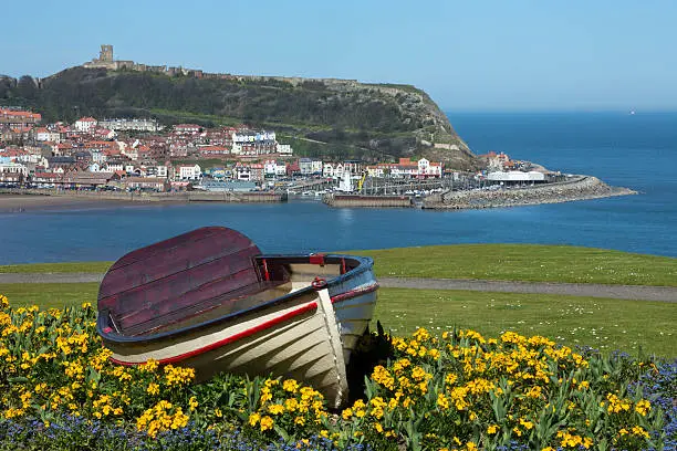 Scarborough Castle on a hillside above the town and harbor - North Yorkshire coast in the northeast of England.