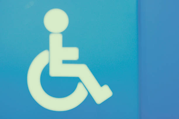 istock Defocused disabled sign on the turquoise wall 528954092