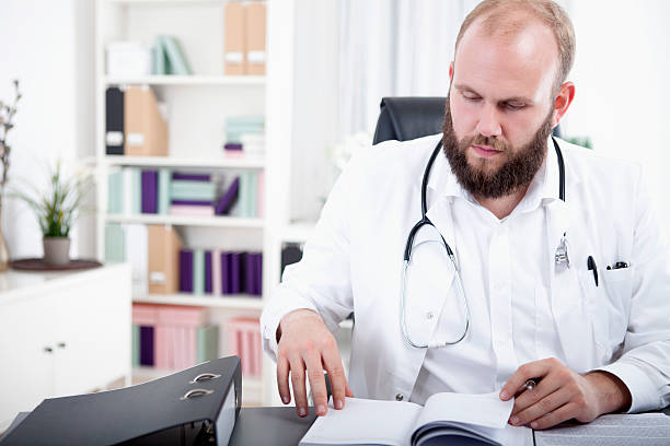 istock Doctor is looking for a free appointment in his calendar 528954267