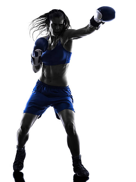 istock woman boxer boxing kickboxing silhouette isolated 528954277