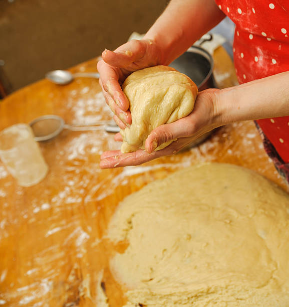 istock prepare meal food. modelling dough in hands 528954466