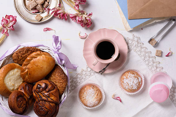 istock Fresh baked pastry with coffee and tulip flowers. 528954634
