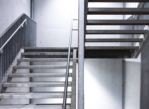 istock steel staircase with beton wall 528955155