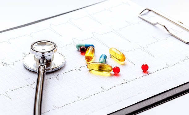 istock new stethoscope on a white background with cardiogram isolated 528955160