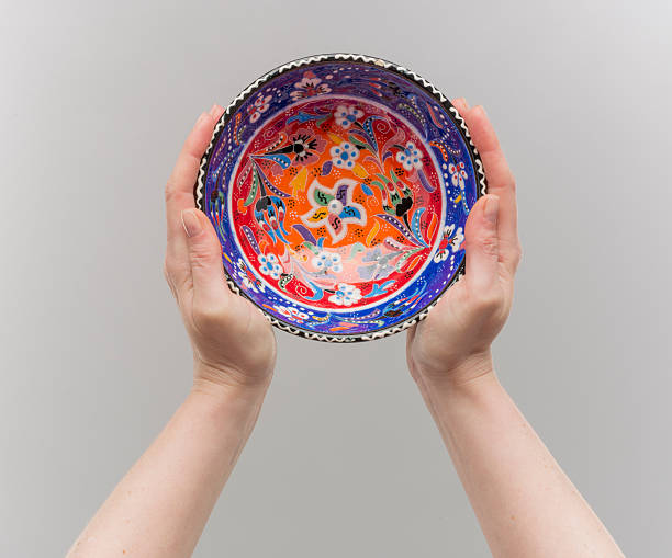 Top view of female hand hold an empty bowl, isolated