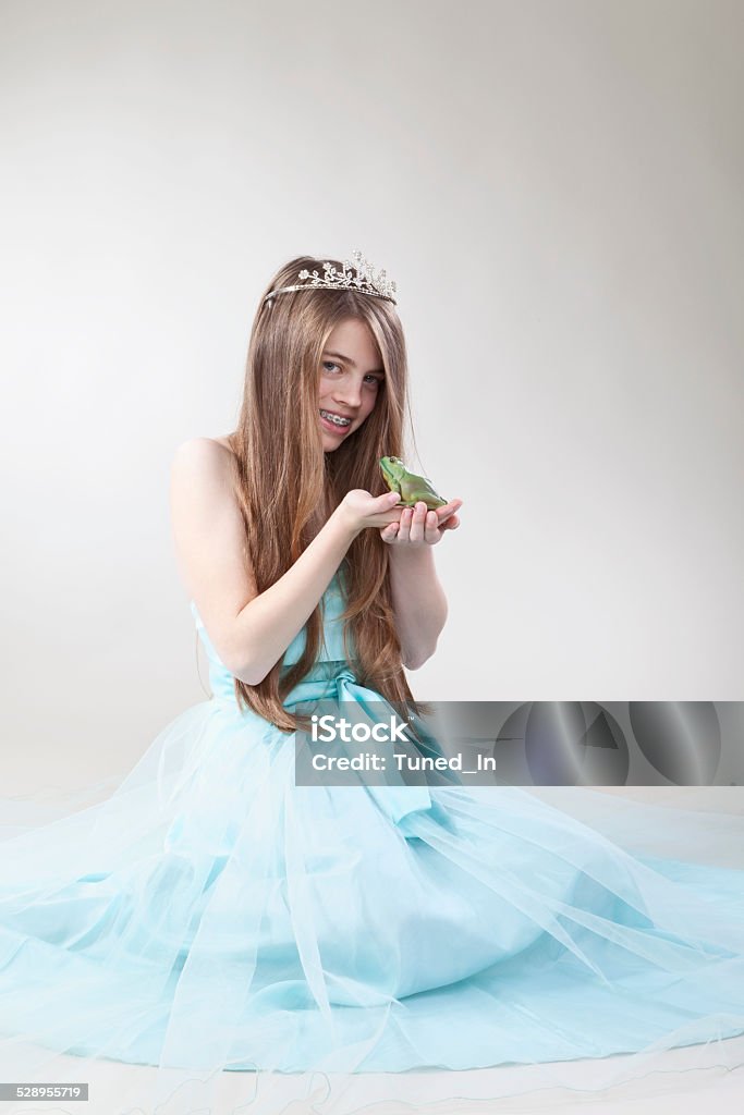 Teenage Girl with frog king, smiling, portrait Dressing Up Stock Photo